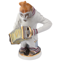 Affenmusiker Schopfpavian mit Ziehharmonika